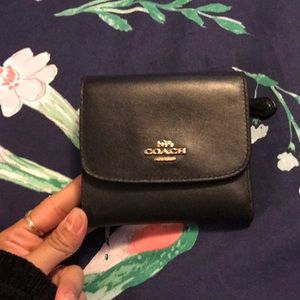 Black leather coach trifold